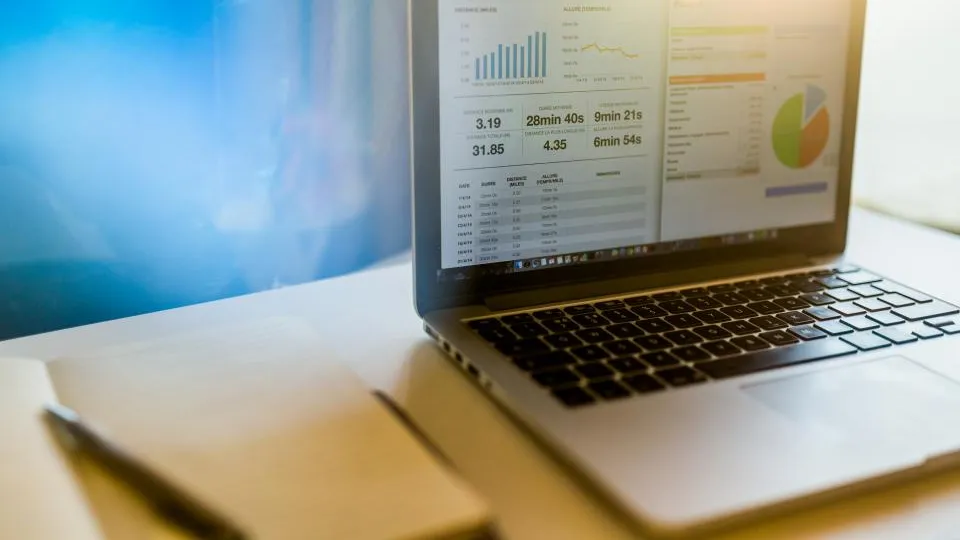 Website project budget and analytics dashboard on a laptop