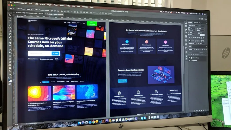 Website redesign mockups open in a design tool on a desktop monitor
